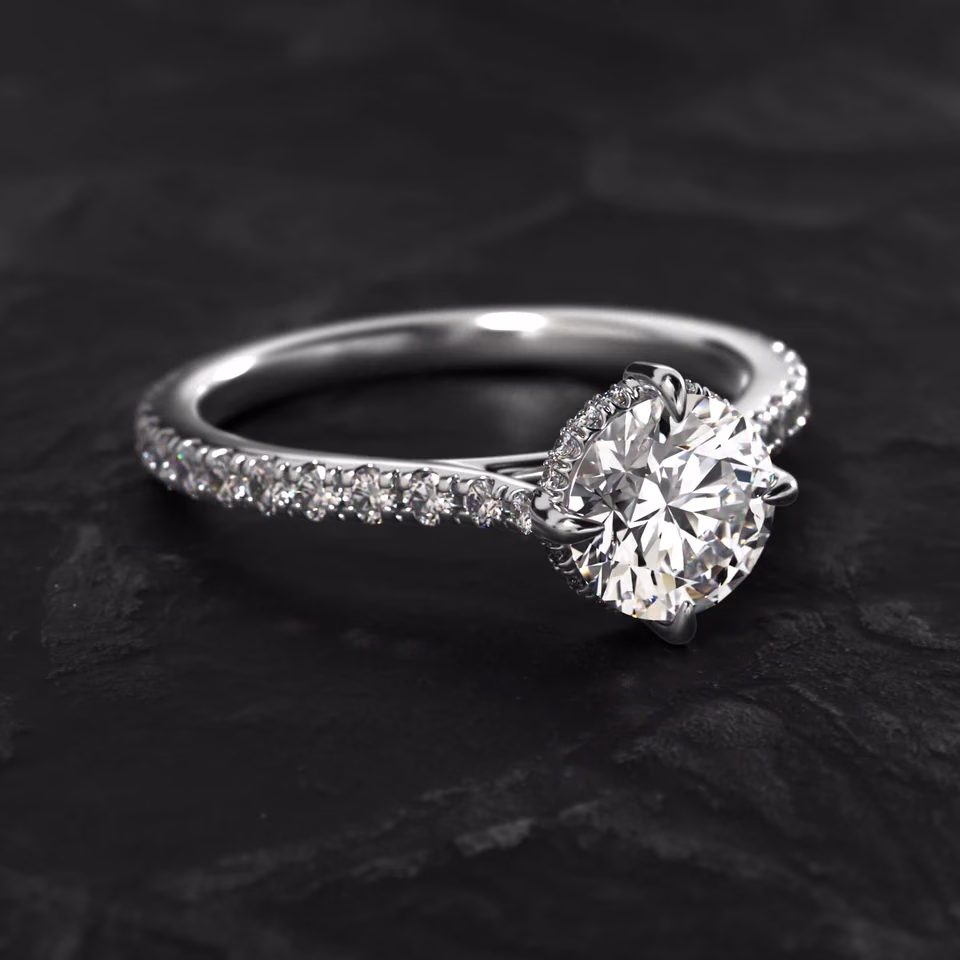 Celeste platinum diamond ring on dark stone