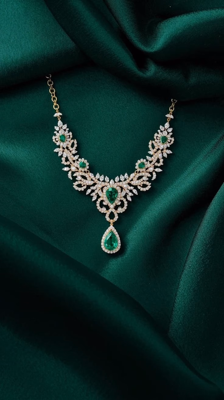 Maharani emerald and diamond necklace on green silk